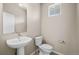 Simple and clean bathroom with pedestal sink and toilet at 21239 E 62Nd Ave, Aurora, CO 80019