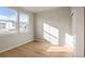 Well-lit bedroom with hardwood floors and neutral color palette at 21239 E 62Nd Ave, Aurora, CO 80019