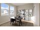 Spacious home office with a desk, shelving, and natural light at 21239 E 62Nd Ave, Aurora, CO 80019