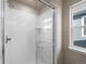 Clean shower with glass enclosure and tile surround at 21239 E 62Nd Ave, Aurora, CO 80019