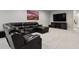 Finished basement featuring a modern sectional sofa and entertainment center at 12938 Bridge View Ln, Parker, CO 80134