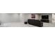 Finished basement area with large television, media console, and comfortable seating at 12938 Bridge View Ln, Parker, CO 80134