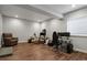 Finished basement area featuring a multi-monitor gaming and computer workstation at 12938 Bridge View Ln, Parker, CO 80134
