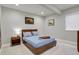 Bedroom with neutral walls, wood bed frame, and natural light at 12938 Bridge View Ln, Parker, CO 80134