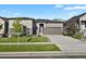 Charming single-Gathering home with a two-car garage, stone accents, and well-maintained landscaping at 12938 Bridge View Ln, Parker, CO 80134