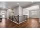 Hallway with hardwood floors leading to the dining room and front entrance at 12938 Bridge View Ln, Parker, CO 80134