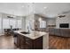 Kitchen island with granite countertops offering seamless transition to the dining and living areas at 12938 Bridge View Ln, Parker, CO 80134