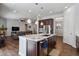Open concept kitchen with granite countertops, stainless steel appliances and seamless access to the living area at 12938 Bridge View Ln, Parker, CO 80134