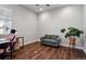 Cozy office space with hardwood flooring and room for seating at 12938 Bridge View Ln, Parker, CO 80134