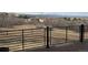 View from the backyard showcasing a metal railing, and distant mountains at 12457 Topaz Vista Way, Castle Pines, CO 80108