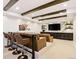 Basement bar with TV and comfortable lounge area featuring a stylish bar and comfortable seating at 12457 Topaz Vista Way, Castle Pines, CO 80108