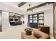 Basement featuring a bar area, display cabinets, and chandelier lighting at 12457 Topaz Vista Way, Castle Pines, CO 80108