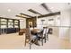 Basement with dining table, recessed lighting, and built in bar area at 12457 Topaz Vista Way, Castle Pines, CO 80108