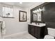Bathroom with stylish vanity, granite countertop, and modern fixtures at 12457 Topaz Vista Way, Castle Pines, CO 80108