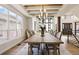 Beautiful dining area featuring wood floors, wainscotting, and modern chandelier at 12457 Topaz Vista Way, Castle Pines, CO 80108