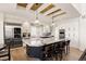 Modern kitchen with a large marble island, stainless steel appliances, and custom cabinetry at 12457 Topaz Vista Way, Castle Pines, CO 80108