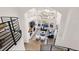 Open-concept living room with a fireplace, large windows, and abundant natural light at 12457 Topaz Vista Way, Castle Pines, CO 80108