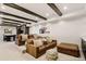 Basement living room with leather seating, recessed lighting and media center at 12457 Topaz Vista Way, Castle Pines, CO 80108
