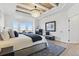 Elegant main bedroom featuring a bay window, coffered ceiling, fireplace and chandelier at 12457 Topaz Vista Way, Castle Pines, CO 80108