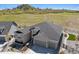 Beautiful home featuring a stone facade, three-car garage, professionally landscaped yard, and mountain views at 547 Scrubjay Cir, Castle Rock, CO 80104