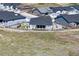 Aerial view of home showcasing backyard, landscaping, and surrounding neighborhood at 547 Scrubjay Cir, Castle Rock, CO 80104