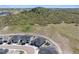 A high aerial view features this home's cul-de-sac location, meticulous landscaping, and adjacent green space at 547 Scrubjay Cir, Castle Rock, CO 80104
