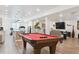 Spacious basement featuring a billiards table, living space, and bar for entertaining at 547 Scrubjay Cir, Castle Rock, CO 80104