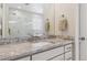 Modern bathroom with a sleek vanity, granite countertops, and a walk-in shower at 547 Scrubjay Cir, Castle Rock, CO 80104