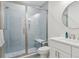 Modern bathroom design featuring blue subway tile shower and white vanity at 547 Scrubjay Cir, Castle Rock, CO 80104
