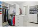 Organized walk-in closet featuring custom shelves, clothing racks, and a center drawer unit at 547 Scrubjay Cir, Castle Rock, CO 80104