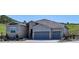 The home's exterior showcases a combination of stone and siding, complemented by a three-car garage at 547 Scrubjay Cir, Castle Rock, CO 80104