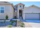 Charming two-story home with a stone facade, landscaped yard, and a two-car garage at 547 Scrubjay Cir, Castle Rock, CO 80104
