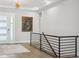 Bright foyer with modern light fixture, hardwood floors, and elegant decor at 547 Scrubjay Cir, Castle Rock, CO 80104