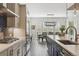 Modern kitchen featuring an island, stainless steel appliances, and dining area at 547 Scrubjay Cir, Castle Rock, CO 80104
