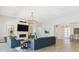 Spacious living room with modern fireplace, stylish lighting, and open floor plan at 547 Scrubjay Cir, Castle Rock, CO 80104