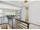 Open-concept living room with hardwood floors, a fireplace, and views of the backyard at 547 Scrubjay Cir, Castle Rock, CO 80104
