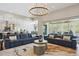 Spacious living room flowing into the kitchen and dining area, perfect for entertaining guests at 547 Scrubjay Cir, Castle Rock, CO 80104