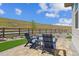 Cozy backyard patio with blue Adirondack chairs, perfect for relaxing at 547 Scrubjay Cir, Castle Rock, CO 80104