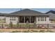 Home has a full-width covered rear porch that is ideal for entertaining at 547 Scrubjay Cir, Castle Rock, CO 80104