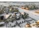 Aerial view of a residential neighborhood with houses and snowy landscape at 6350 Stable View St, Castle Pines, CO 80108