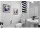 Modern bathroom with pedestal sink and updated fixtures at 6350 Stable View St, Castle Pines, CO 80108