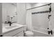 Clean bathroom with white cabinets and bathtub shower combo at 6350 Stable View St, Castle Pines, CO 80108