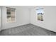 Spacious bedroom with gray carpeting and large windows at 6350 Stable View St, Castle Pines, CO 80108