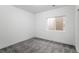 Bright bedroom with grey carpet and a window at 6350 Stable View St, Castle Pines, CO 80108