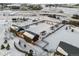 Aerial view of a community park with playground, pavilion, and open space in winter at 6350 Stable View St, Castle Pines, CO 80108