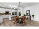 Kitchen dining area with round table, four chairs, and view to living area at 6350 Stable View St, Castle Pines, CO 80108