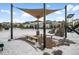 Covered seating area in a park with benches, trash can, and playground in background at 6350 Stable View St, Castle Pines, CO 80108