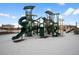 Modern playground with climbing structures and slides in the snow at 6350 Stable View St, Castle Pines, CO 80108