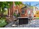 Backyard patio with stone paving and an outdoor firepit and chairs for entertaining at 1160 York St, Denver, CO 80206