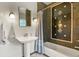 Classic bathroom with pedestal sink and tiled shower at 1160 York St, Denver, CO 80206